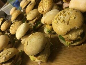 Chicken sliders prepared on a wooden board