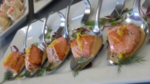 Pan seared salmon spoons attractive display on a platter