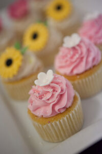 Pink cup cakes part of cup cake platter
