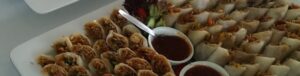 Vietnamese spring rolls with dip in serving bowls